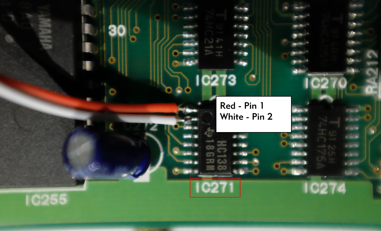 Closeup picture of the SY99 DM2 board, with IC271 highlighted, showing the 2 wires soldered to pins 1 and 2. The picture also shows the capacitor next to IC271 that should be bent away from IC271.